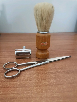 Vintage barber set with Gillette safety razor, shaving brush, and scissors like new