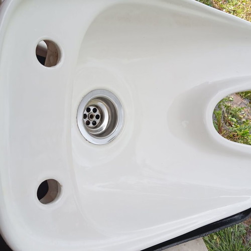 White porcelain hair salon sink used