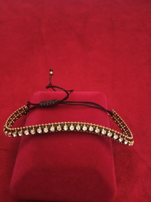 Handmade bracelet with strass and adjustable black and gold details