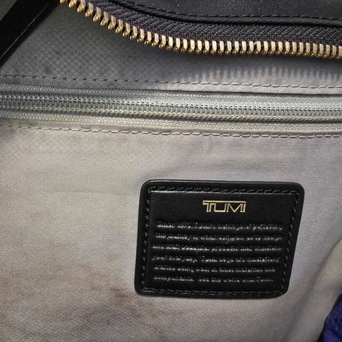 Tumi backpack used, black with gold details