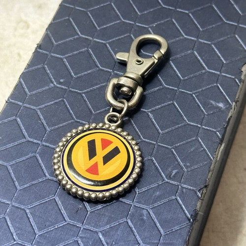 Volkswagen vintage metal keychain with classic logo, used