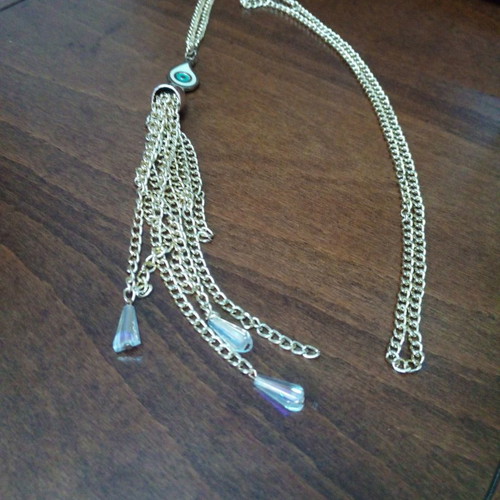 Enameled eye pendant used with gold chain and tassels