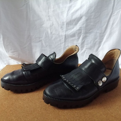 Women's black leather loafers with tassels and snap buttons, size 37