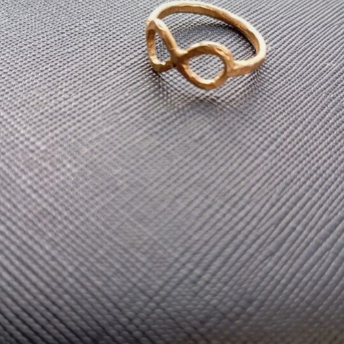 Gold infinity ring like new, made of steel