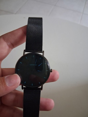 Geneva wristwatch used with black mesh metal strap