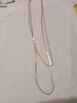 Double necklace used, metallic gold color