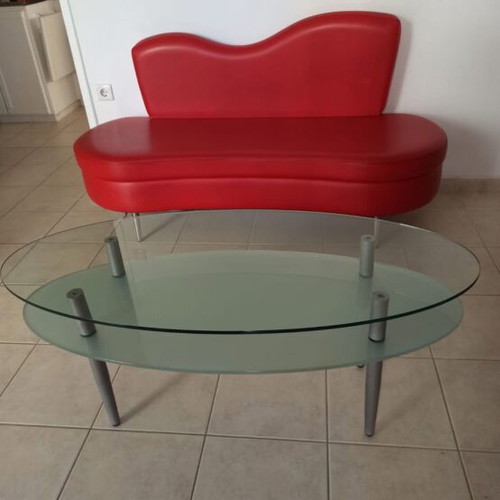 Red sofa and glass coffee table