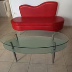 Red sofa and glass coffee table