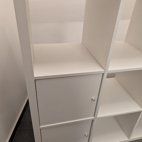 IKEA Kallax white shelving unit with 4 inserts