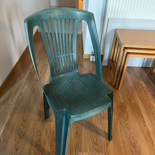 Set of 4 green plastic garden chairs