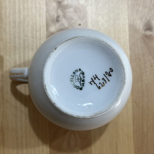 Porcelain tea set used with floral pattern, teapot, creamer, sugar bowl