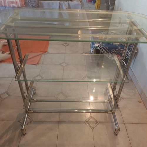 Glass professional shelving unit used with sandblasted glass and nickel frame