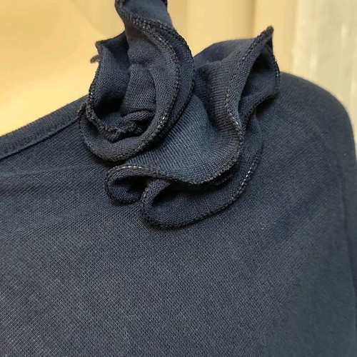 Navy draped blouse like new, size M/L with flower detail