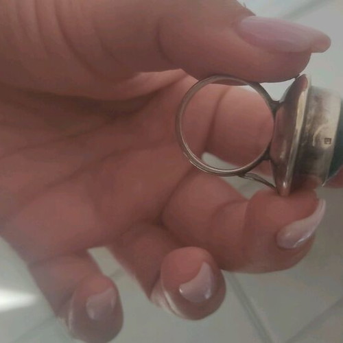 Silver large ring with petrol oval stone used