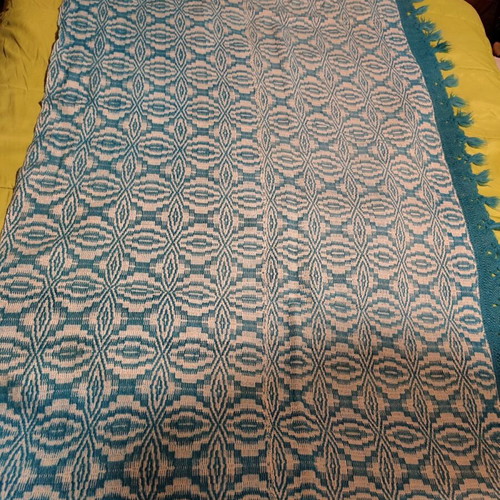 Handmade wool woven blanket used with knitted lace