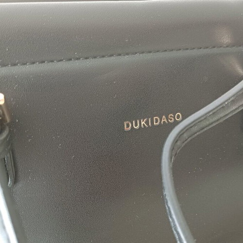 Duki Daso shoulder bag like new, black with gold details