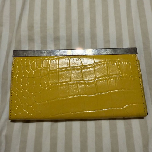 Clutch wallet like new, yellow, bought from NY