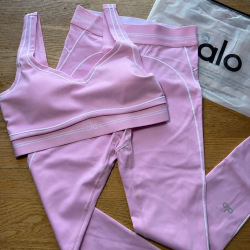 Alo Yoga pink matching set with sports bra and high-waisted leggings
