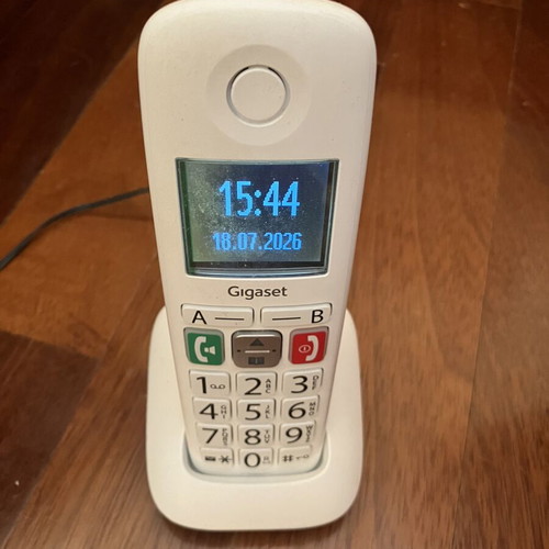 Cordless landline telephone with big numbers used, white