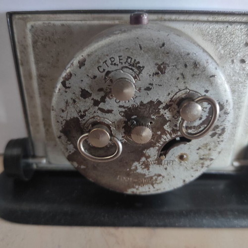 Slava mechanical alarm clock used, analog table clock