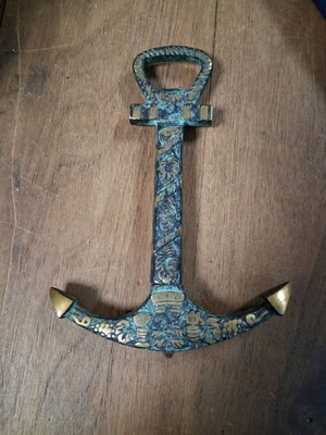 Vintage brass bottle opener used with beautiful patina