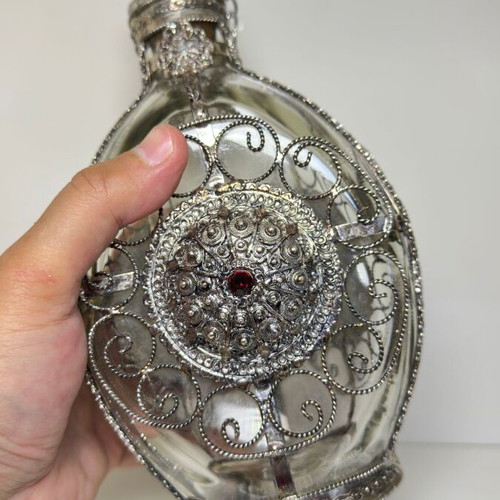 Vintage ornate handmade filigree glass bottle with red stones