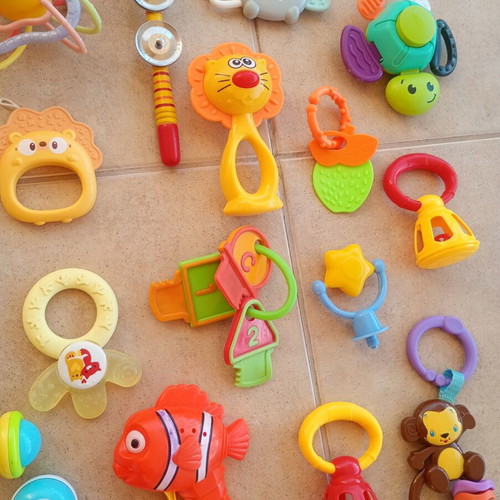 Set of 32 baby rattles including plush toys and large dice