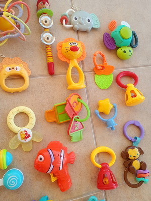Set of 32 baby rattles including plush toys and large dice