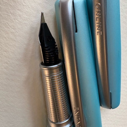 Online pen set like new with black ink and pen