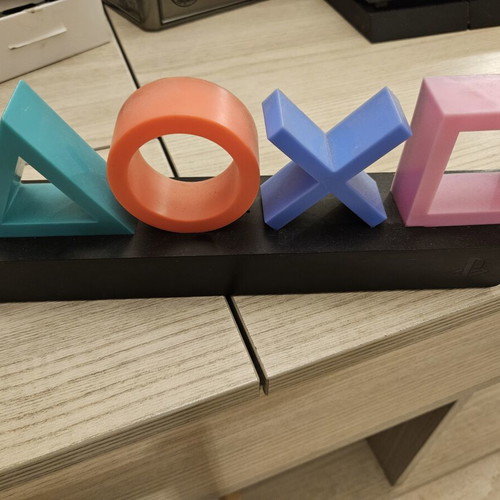 PlayStation Icons Lamp like new with colored symbols on black base