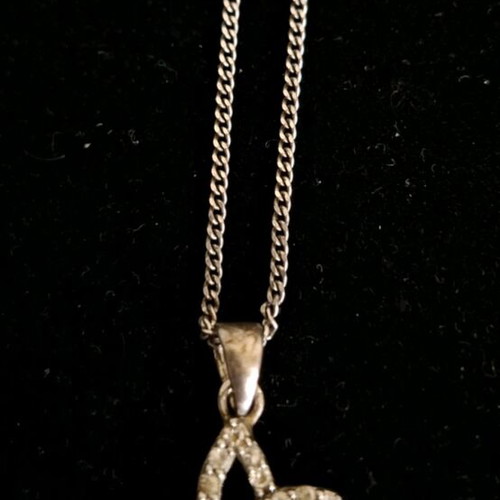 Silver 925 necklace like new with fairy pendant and clear stones