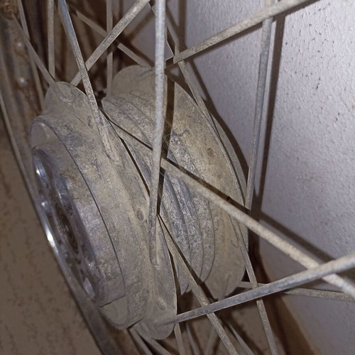 Motorcycle rim used, old with surface rust and missing spoke