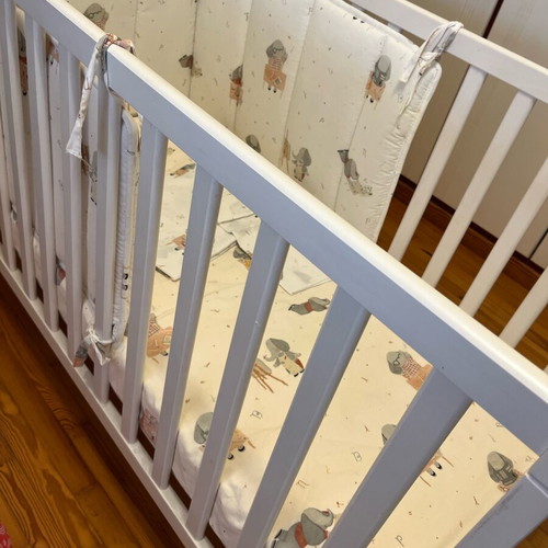 Baby cot like new with unused bedding set and cot bumper