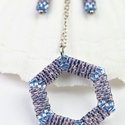 Custom-made jewelry set in light blue tones with hexagonal pendant