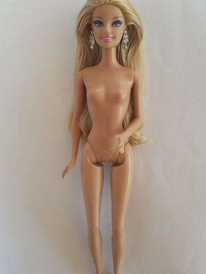 Barbie doll used, good condition with glue seepage on hair