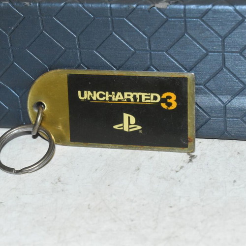 Uncharted 3 PlayStation keychain used, metal collectible