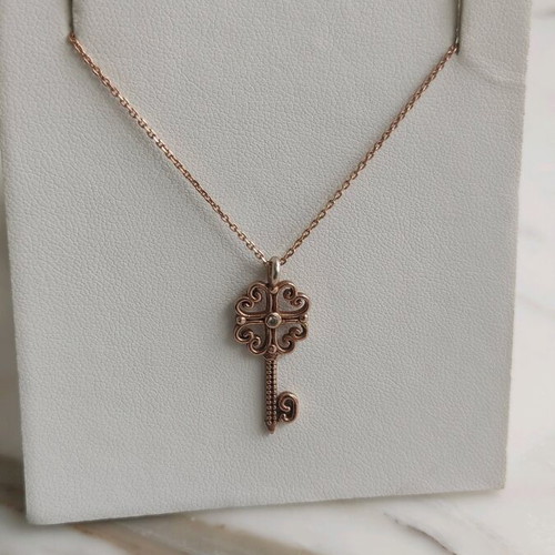 Silver gold-plated key-shaped pendant like new
