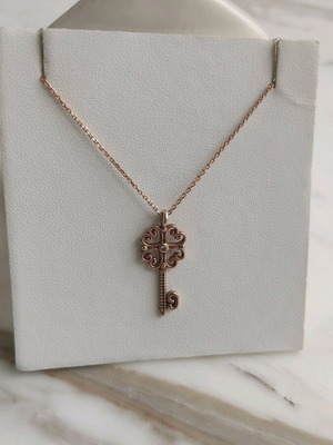Silver gold-plated key-shaped pendant like new