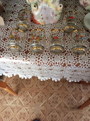 Crystal glasses with gold trim and vintage car designs like new