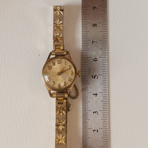 Vintage Swiss Made women's watch, gold plated with safety chain, 20 MC
