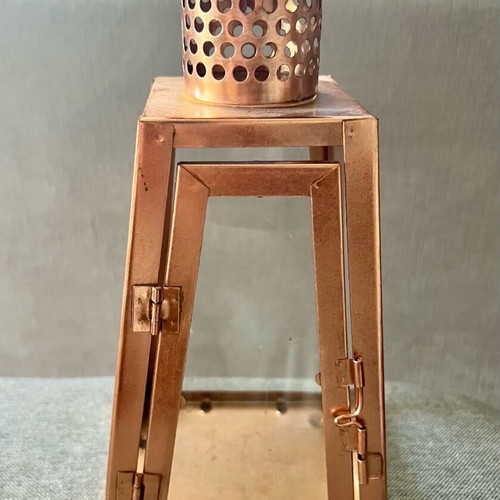 Metal candle lantern used, copper color