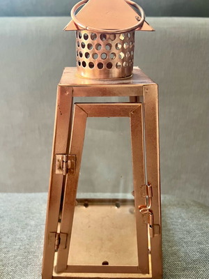 Metal candle lantern used, copper color
