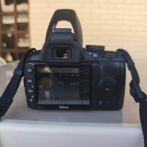 Nikon D3000 camera with AF-S 18-55mm f/3.5-5.6 lens and bag