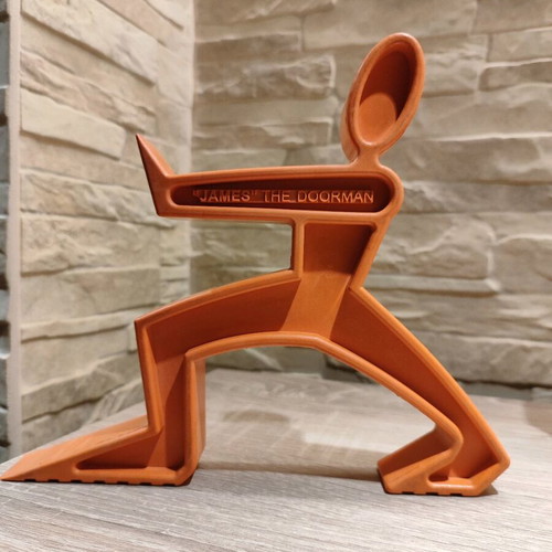 Doorstop "James the Doorman" like new, orange