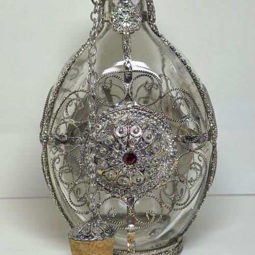 Vintage ornate handmade filigree glass bottle with red stones