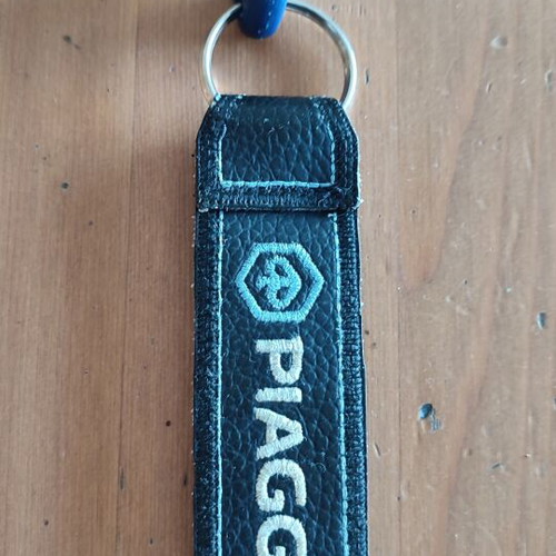 Piaggio leather fabric keychain