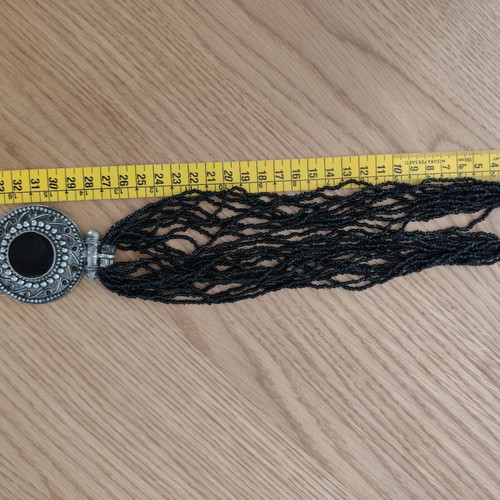 Long necklace with round pendant and bells, like new