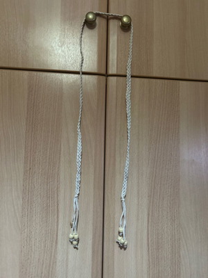 Woven beige belt with beads at the end used, adjustable