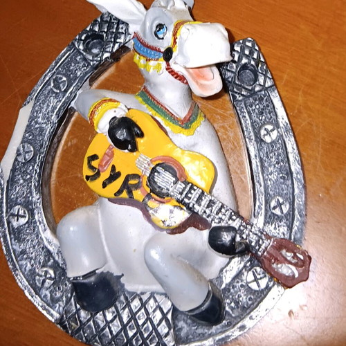 Syros magnet like new, horseshoe with donkey playing guitar