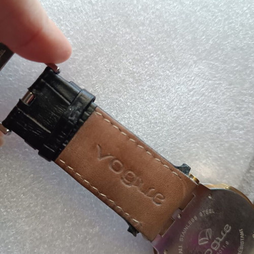 Vogue watch used with white dial and black leather strap